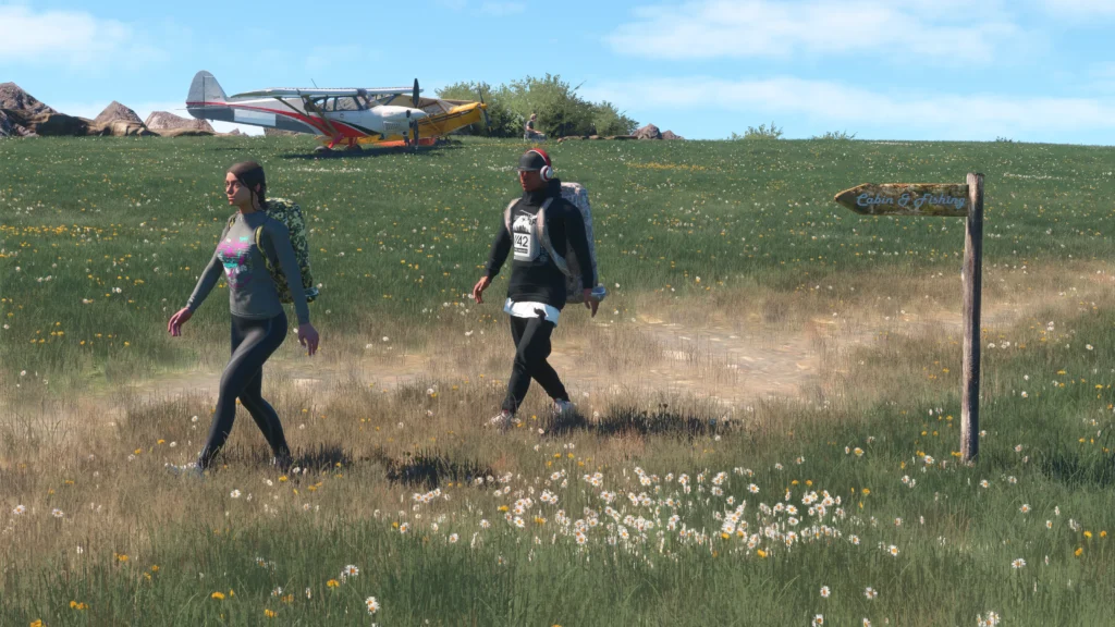 Parallel 42 Widows Peak - Shot of people walking away from aircraft parking on ground at grass airstrip