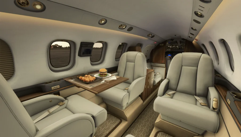 Interior of P180 in a simulator with food on the tray table