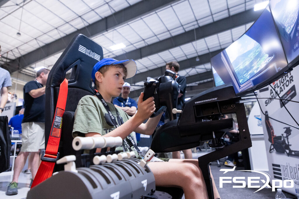A person flying a flight simulator