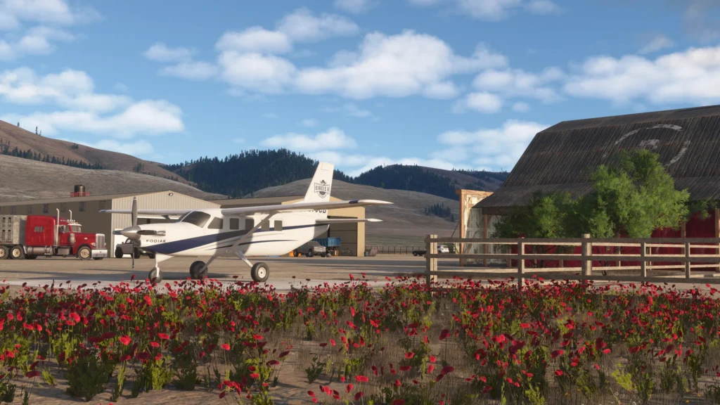 Circle B Ranch by Parallel 42 - Kodiak by Barn with Semi truck in the background