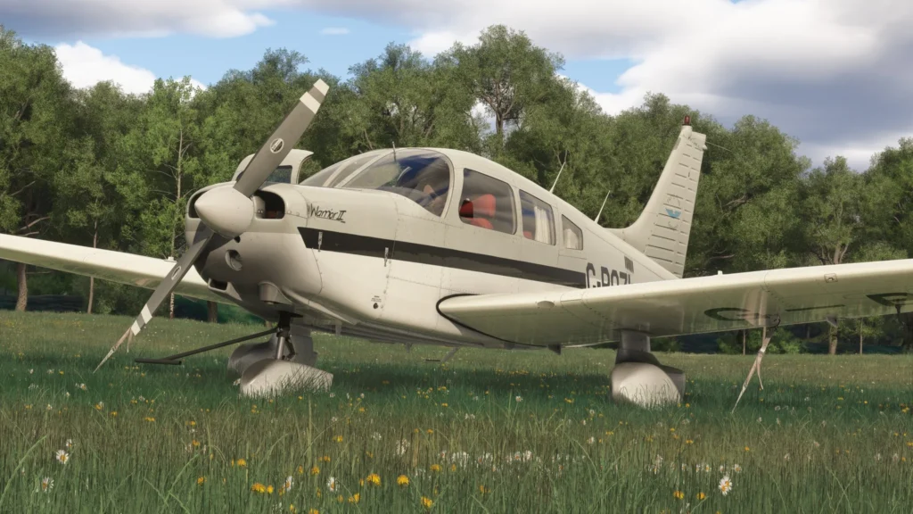 A preview of the Just Flight PA28 tied down on a grass airfield in MSFS2024.