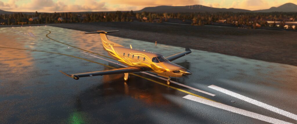 SWS PC-12 at sunset on a wet runway