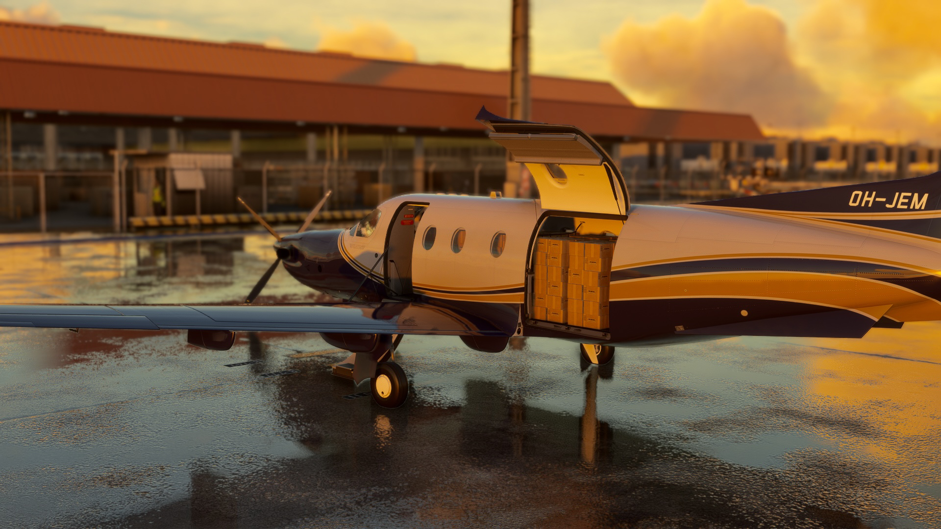 SWS Pilatus PC-12 on a ramp with Cargo door open