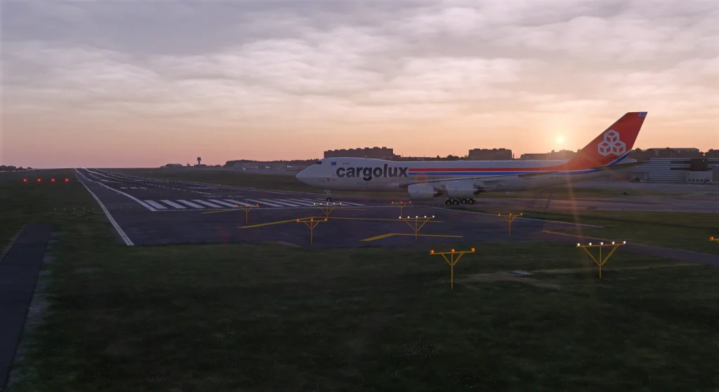 Insim view of Atelic's Luxembourg airport for MSFS 2020 & 2024. Xargolux Boeing 747-400 F lining up for take off at sunset with a great view of the slopped runway