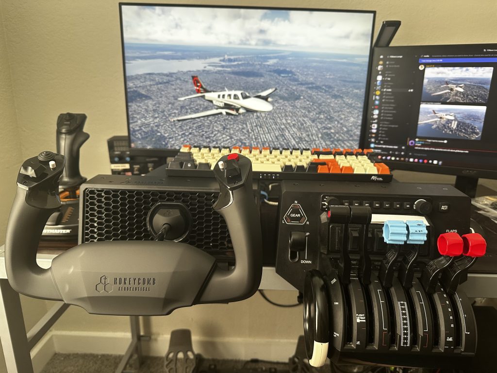 Image showing the Alpha Lite mounted on a desk alongside the Honeycomb Bravo