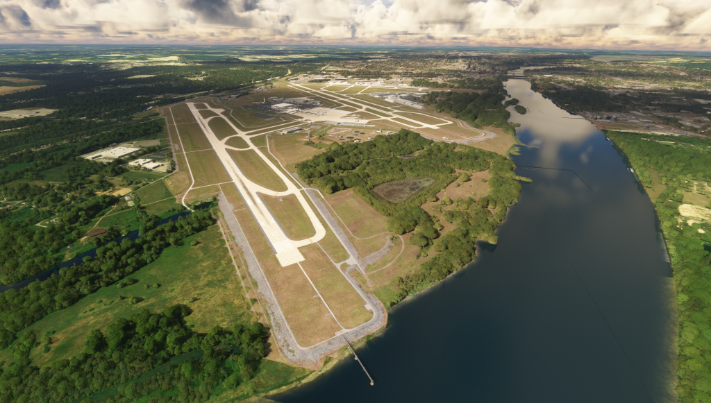 Aerial view of Bill and Hillary Clinton National Airport (KLIT) showing its long runways and surrounding area.