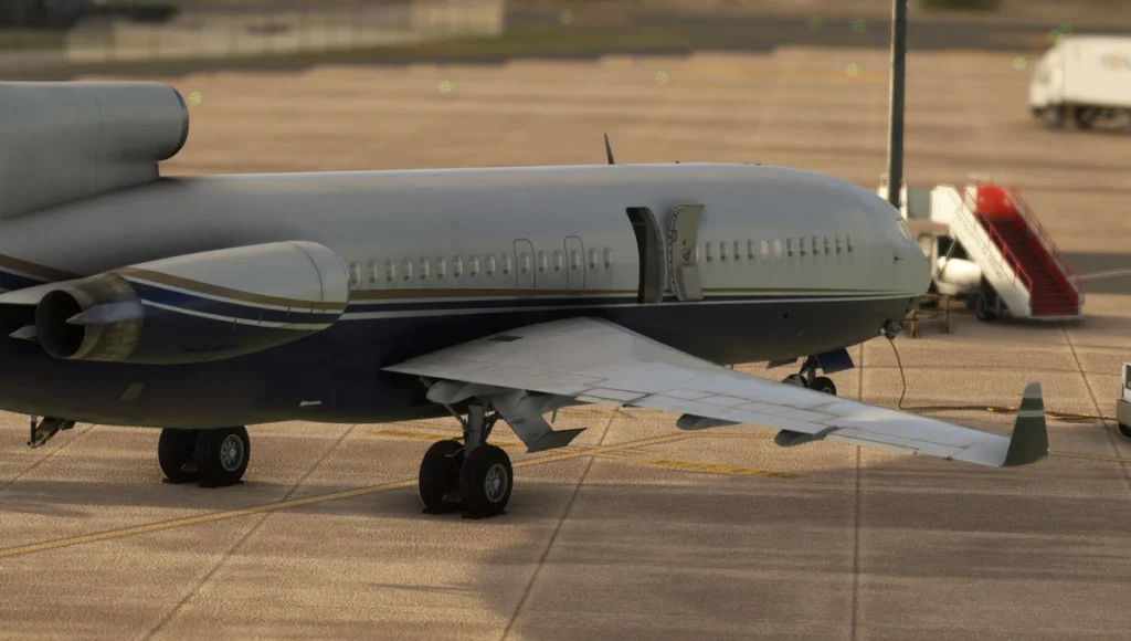 Boeing 727 winglet variant parked on the ramp with ground equipment nearby