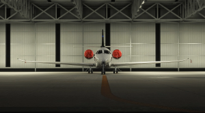 Front view of Skyward Simulations Cessna Citation C680 Sovereign+ inside hangar for MSFS