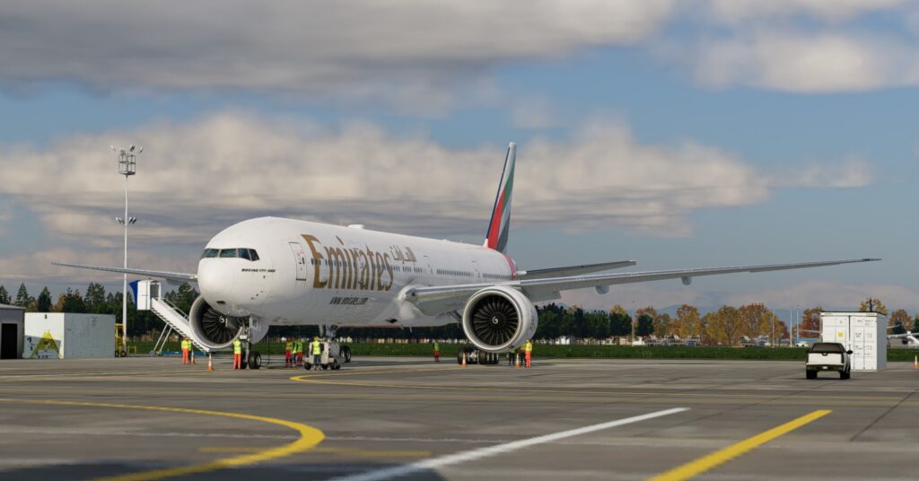 FlightFactor Boeing 777-300ER for X-Plane 12 parked on apron in Emirates livery with ground crew and detailed exterior modelling