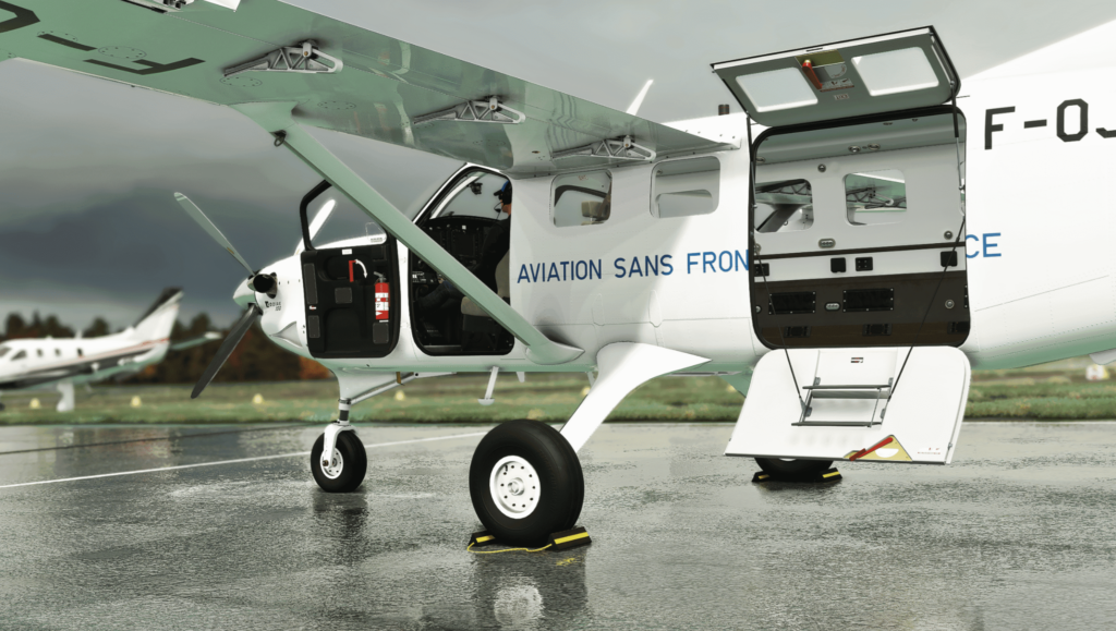 Kodiak 100 Series II on the ground with cargo door open, showcasing utility configuration in Microsoft Flight Simulator 2024