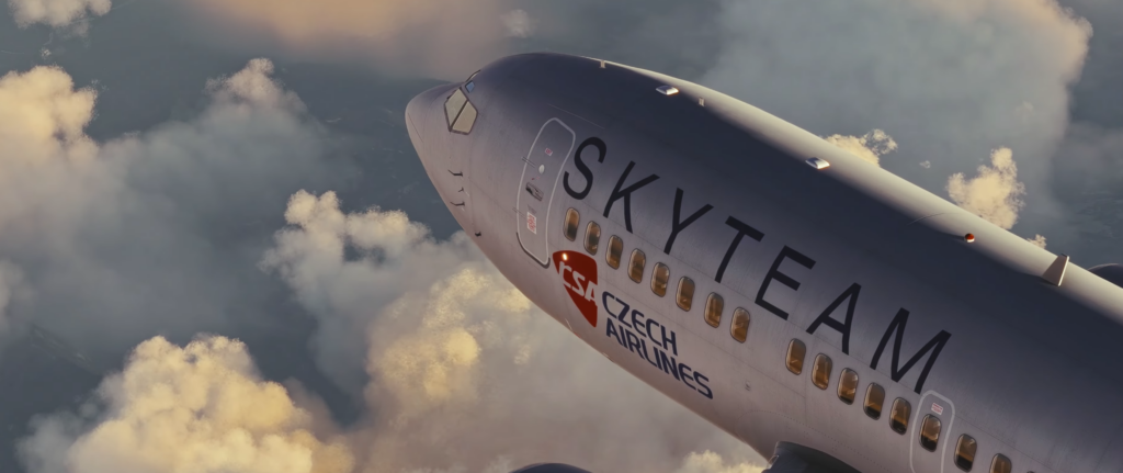 CSS 737-500 update 1.9.0 showing SkyTeam livery flying above clouds in MSFS