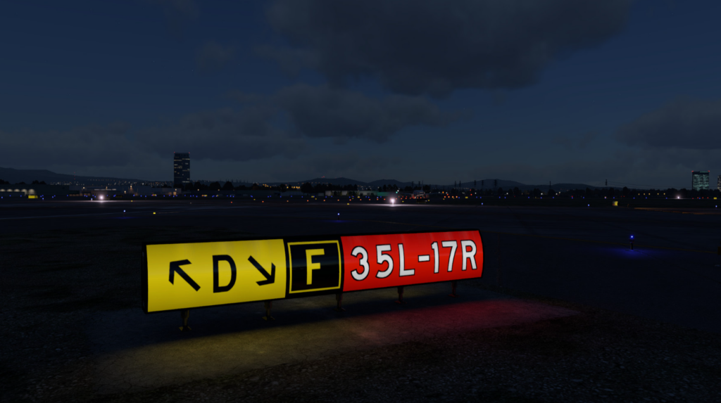 Illuminated taxiway signs at night in Airport Enhancement Package for X-Plane 12