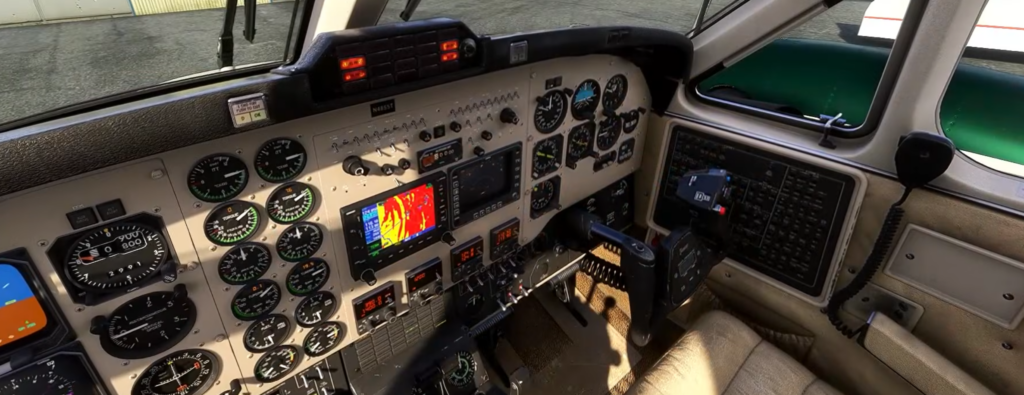 Carenado B200 cockpit featuring analog instruments and avionics suite in MSFS 2024