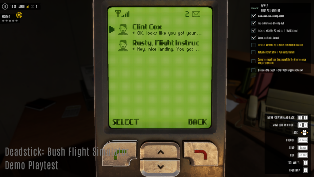 Image of Deadstick's phone, an early 2000s style cellphone with a green, pixelated screen showing SMS messages
