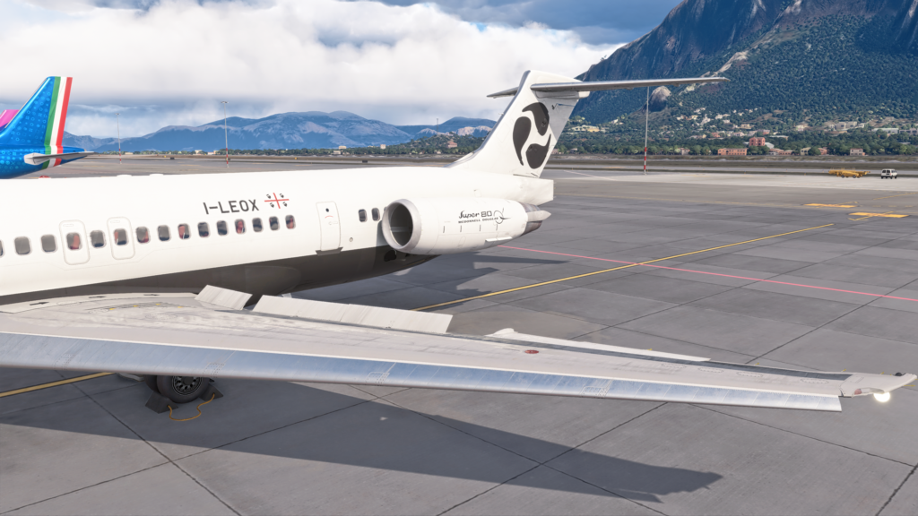 Fly the Maddog screenshot showing the aircraft on the apron with spoilers deployed.
