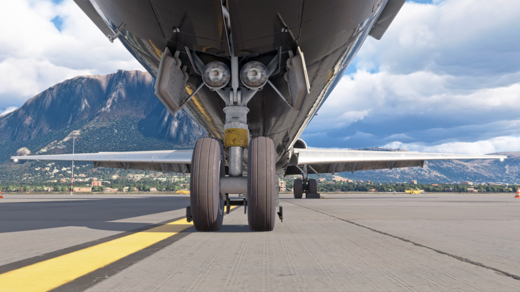 Close up view of the nose landing gear of the Fly the Maddog aircraft on the apron.