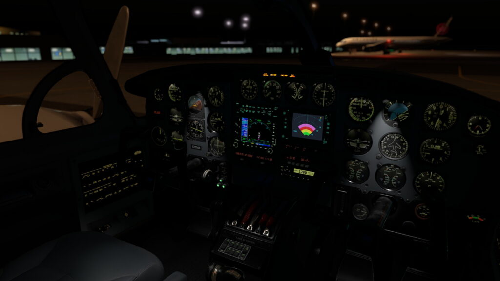 CIS Piper Chieftain cockpit with steam gauges and modern avionics at night