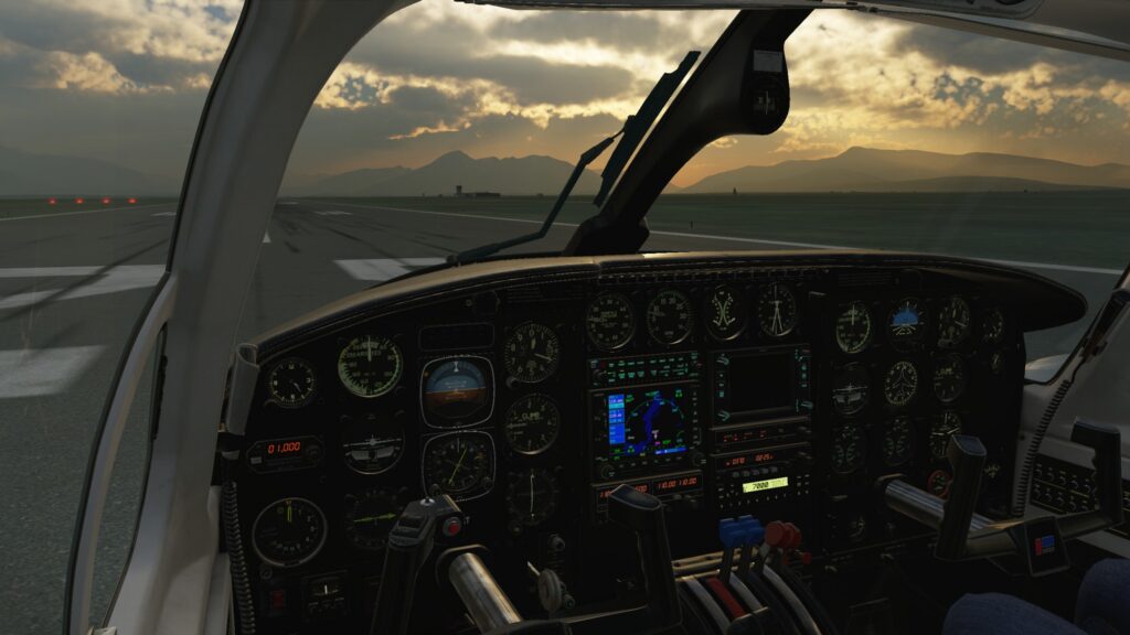 CIS Piper Chieftain cockpit with steam gauges and modern avionics at sunset on the runway