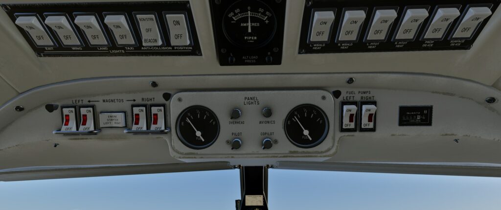 CIS Chieftain cockpit overhead panel with light, de-ice, fuel pump and magneto switches as well as fuel gauges.