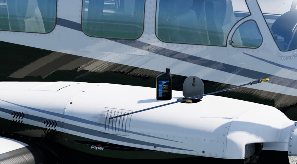 Close-up of the Piper Chieftain&rsquo;s fuselage and wing with oil filler and dipstick visible on top of right engine cowling