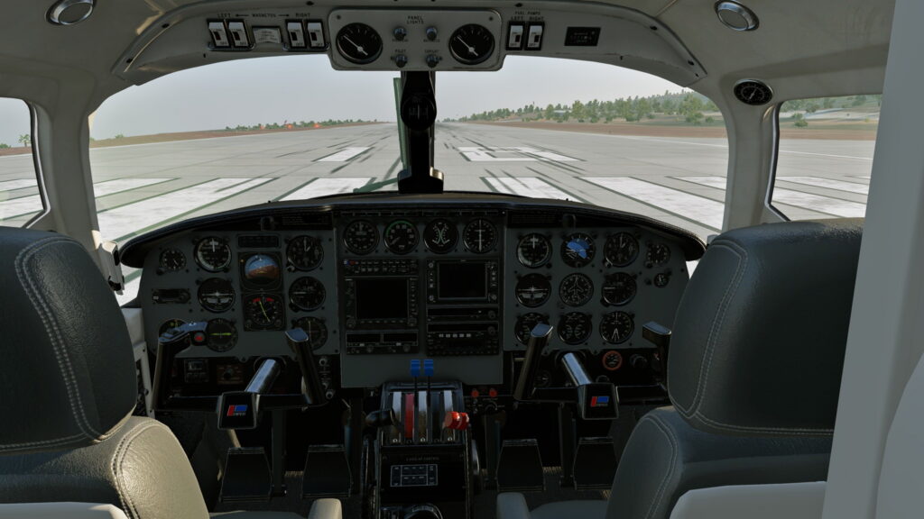 CIS Piper Chieftain cockpit with analog gauges and avionics on the runway