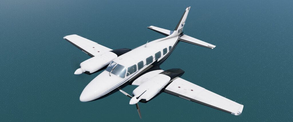 CIS Piper Chieftain twin-engine aircraft in flight over water with left engine shut down