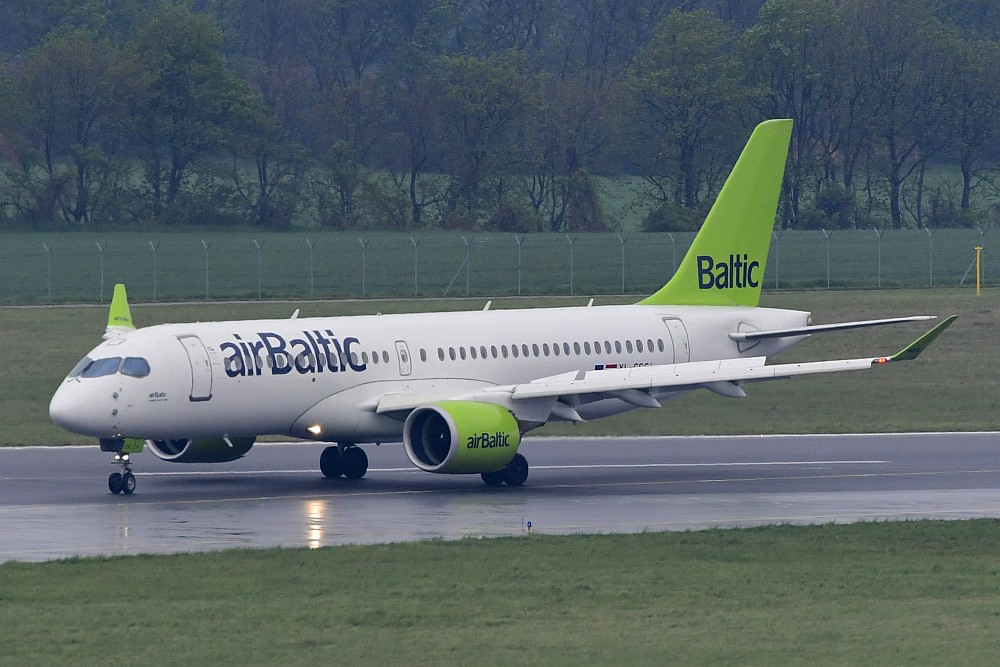 airBaltic Airbus A220-300 landing in wet conditions during a European commercial flight