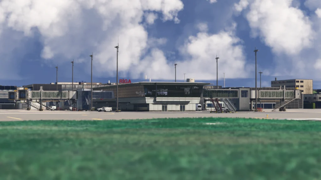 Lisium Design Riga International Airport scenery in Microsoft Flight Simulator 2020 and 2024, showing the main terminal, jet bridges and apron from across the airfield.
