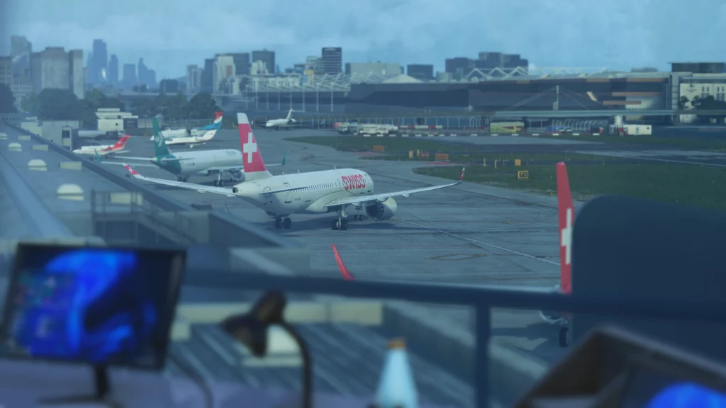 iniBuilds London City Airport scenery in Microsoft Flight Simulator 2024, showing a SWISS aircraft taxiing past the terminal with the London skyline in the background.