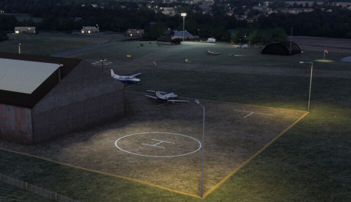 Screenshot of a detailed airport scene from Project Airports, featuring runways, buildings, and surrounding terrain.