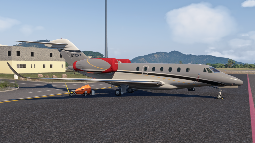 FlightFX Cessna Citation X in Microsoft Flight Simulator 2024 parked at an airport with engine covers in place and GPU attached.