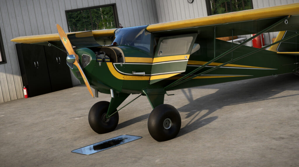 GotFriends Taylorcraft BC-12D parked in a hangar