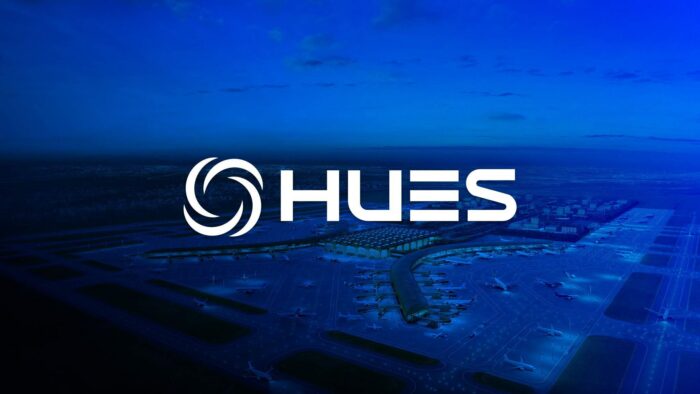 HUES Logo and branding with an image of an airport overview in the background